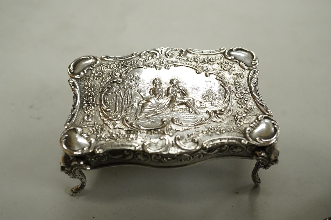 A George V silver mounted oval trinket box, Clark & Sewell, Chester, 1924, 65mm, together with a small silver circular pill box and cover, a 925 double stamp box, and a late Victorian continental silver miniature model o